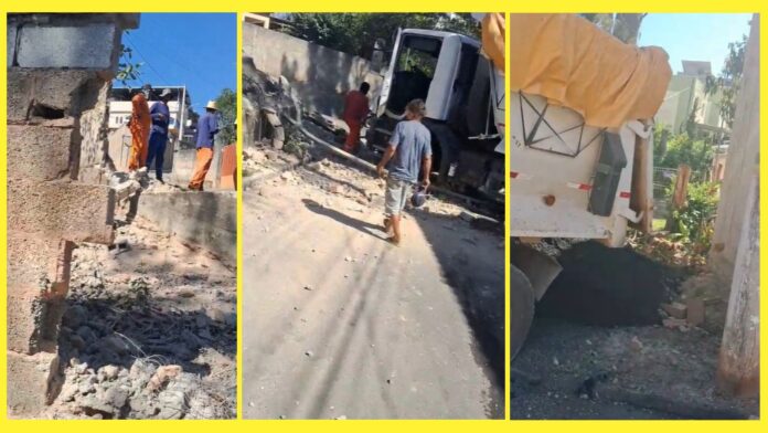 Itabirito: caminhão carregado de asfalto não consegue subir rua, atinge muro e para a metros de uma casa