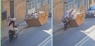 Lafaiete: em moto, casal acerta caçamba, vai parar dentro dela e momento é flagrado em vídeo Lafaiete: em moto, casal acerta caçamba, vai parar dentro dela e momento é flagrado em vídeo